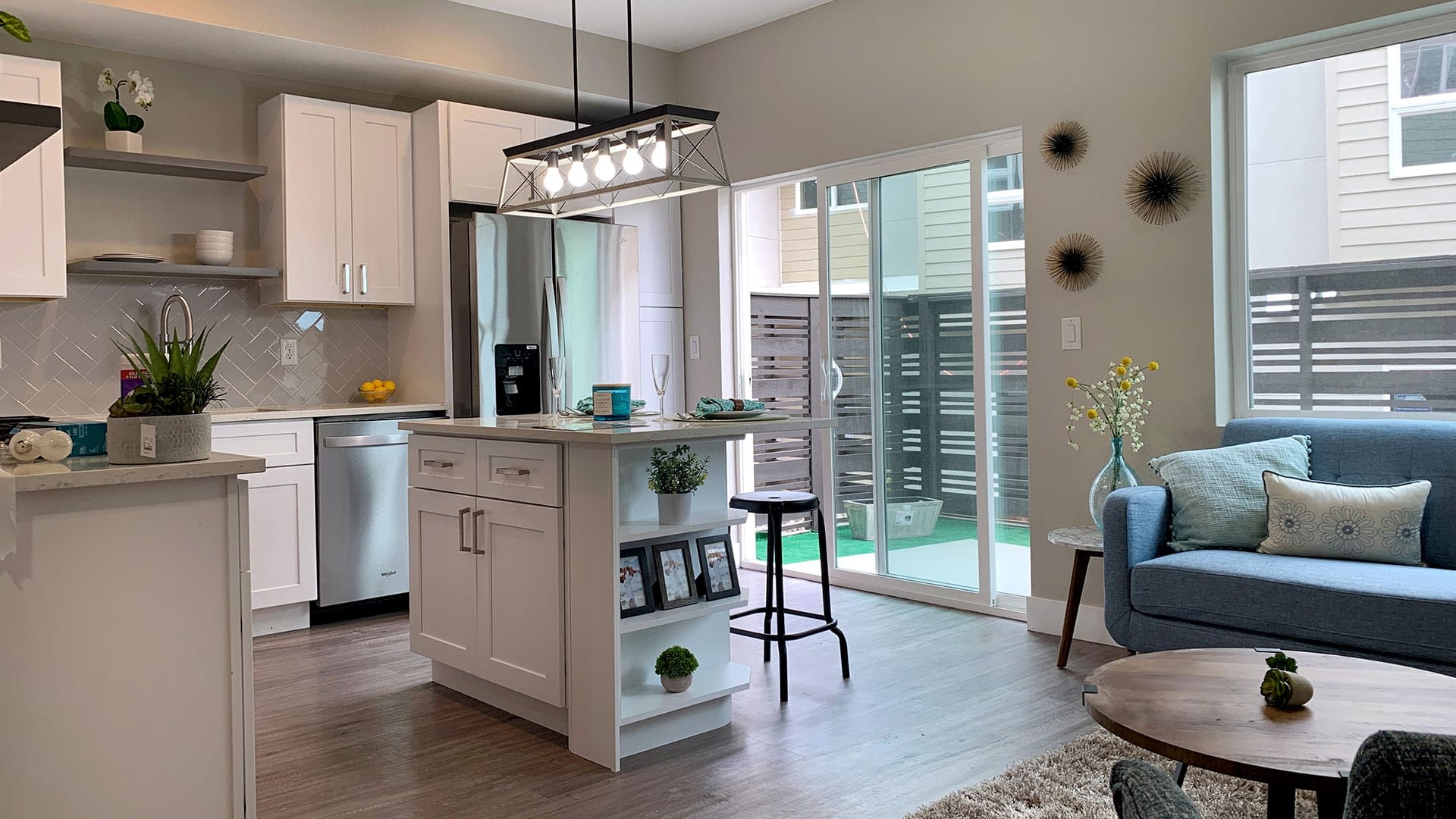 Kitchen/Living Room residential townhouse multi-family Real estate Projects - Weins Development Group - Award-winning real estate developers in Denver, Colorado. Top #1 of Builders producing high-quality townhomes, condos, apartments, retail, & office projects